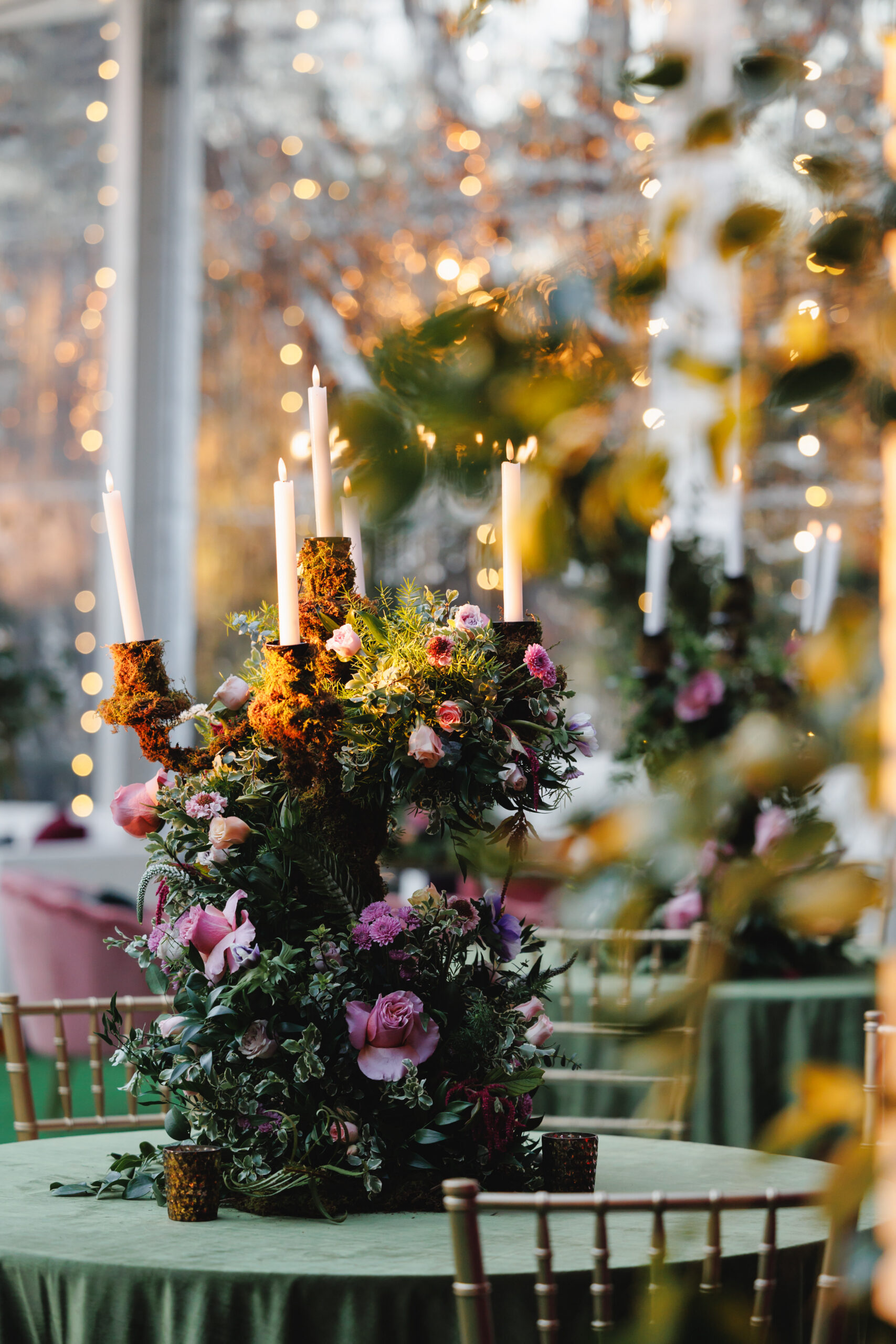 large floral centerpiece with candles