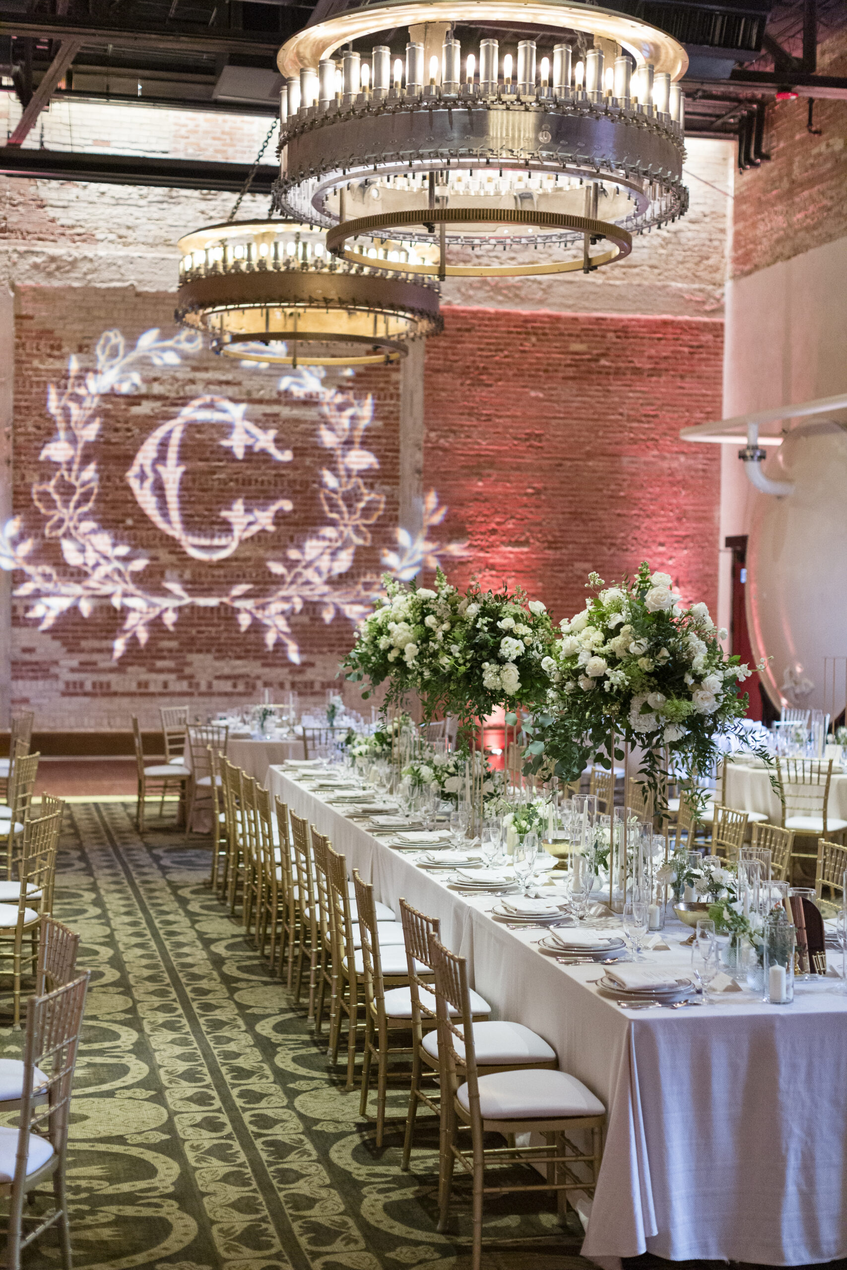 white floral wedding reception centerpieces in tall vases