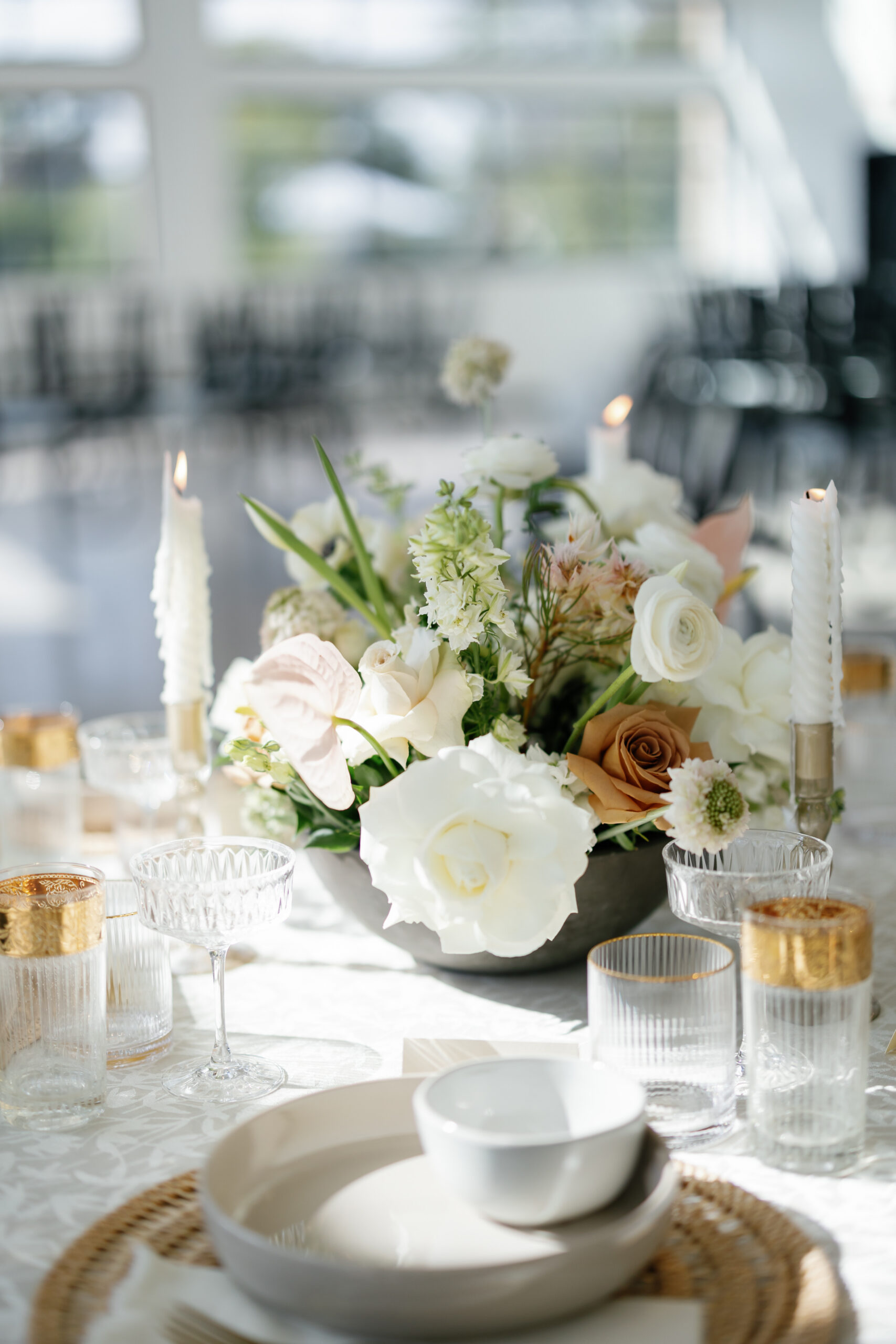 white and orange floral centerpiece for event